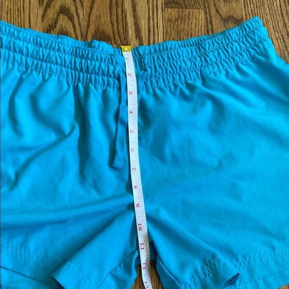 Bright turquoise with white side stripe Nike shorts with pockets, size women’s L - Picture 14 of 16